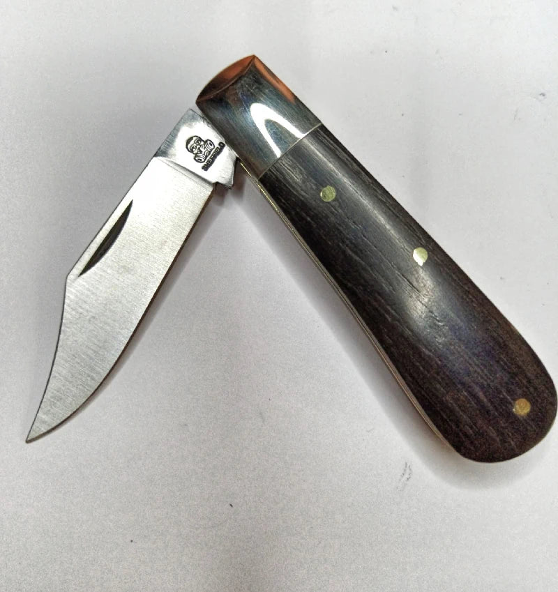 A traditional Sheffield made clip point barlow pocket knife with bog oak scales. 