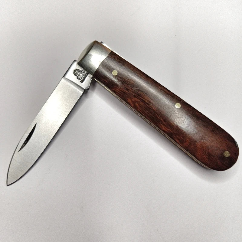 A traditional Sheffield made pocket knife with a spear point blade and desert ironwood handles.