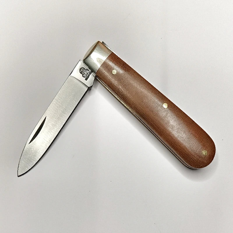 A traditional Sheffield made pocket knife with a spear point blade and brown linen micarta handles. 